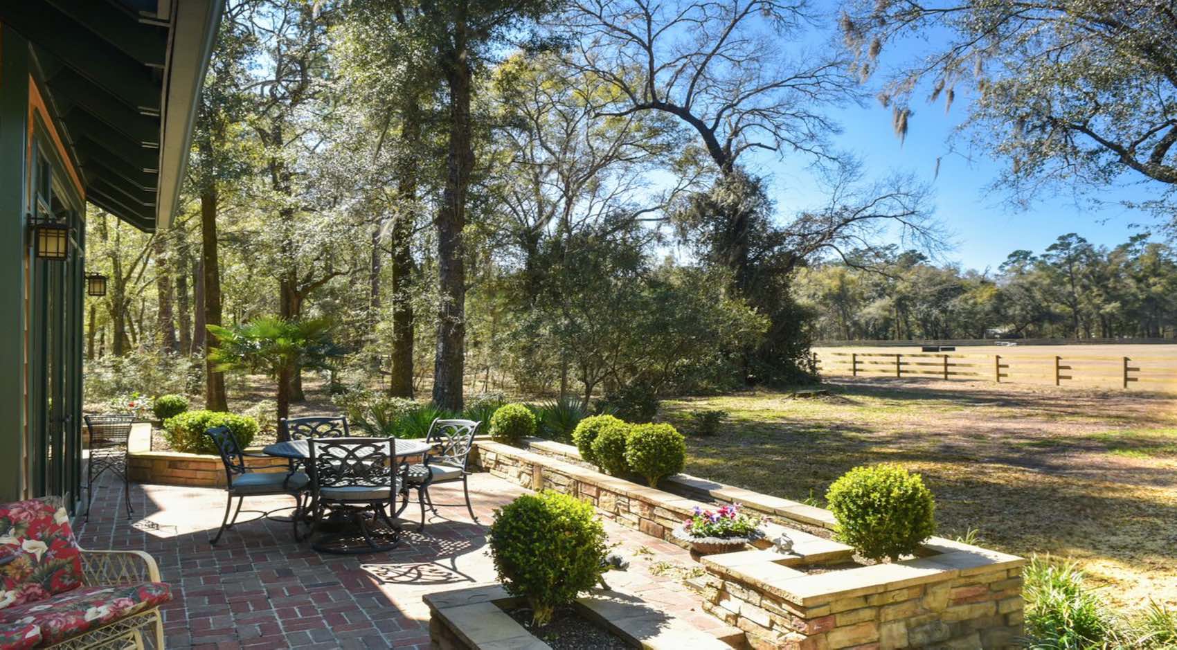 Outdoor patio overlooking large yard 